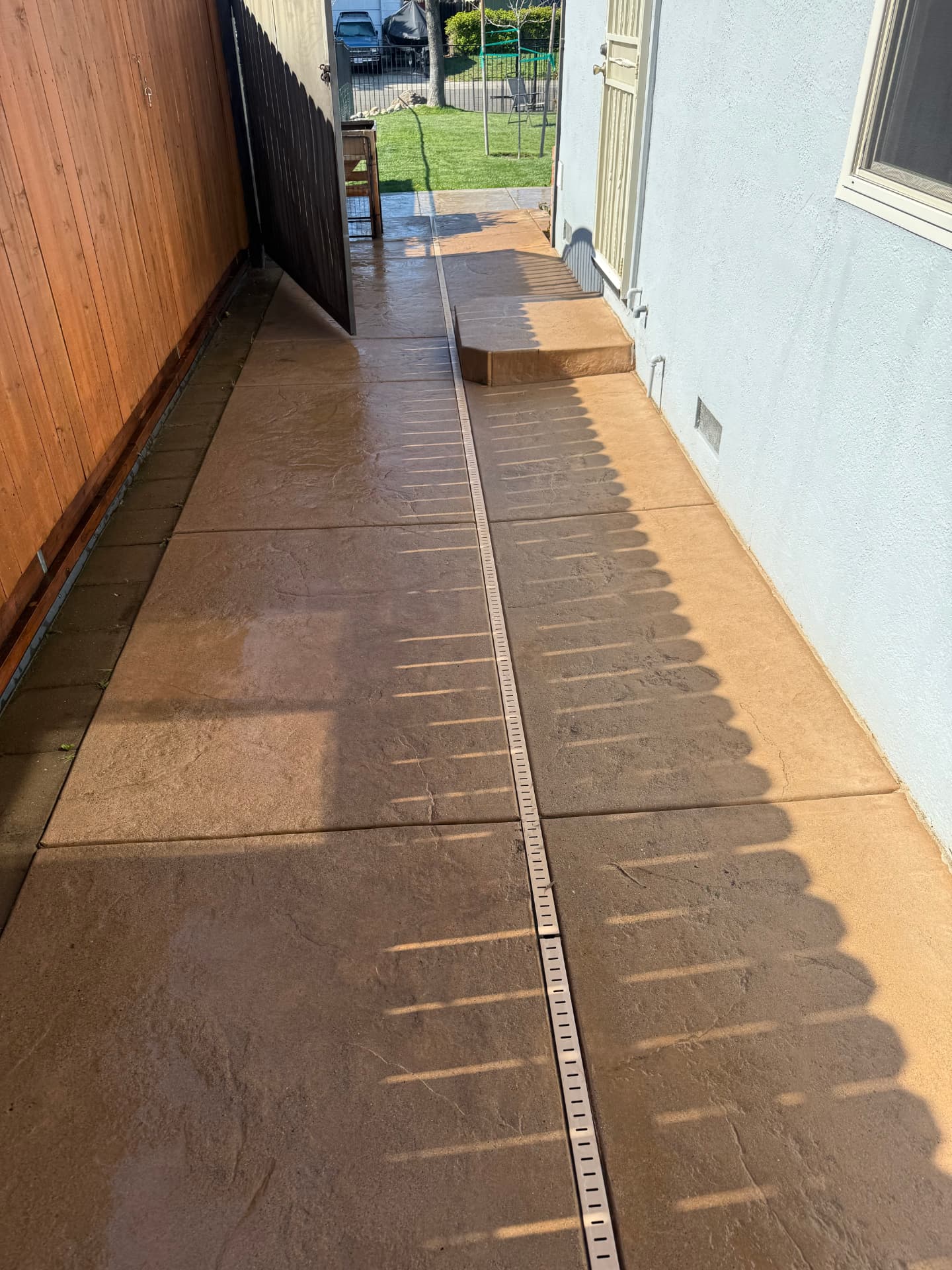 Stamped concrete walkway restored by CSG pressure washing at a Sacramento-area home