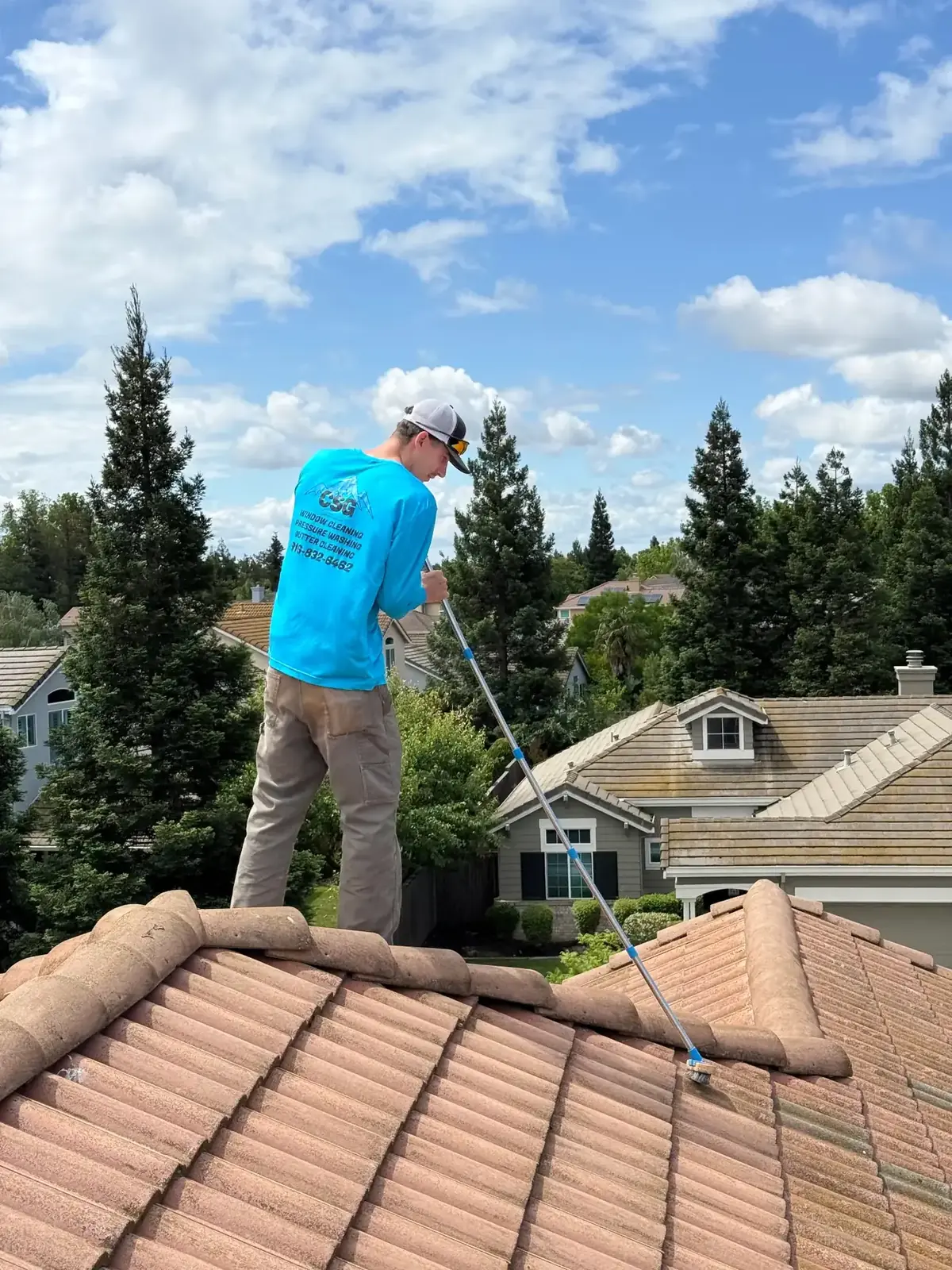 Roof Cleaning (Soft Washing) being performed by a CSG technician