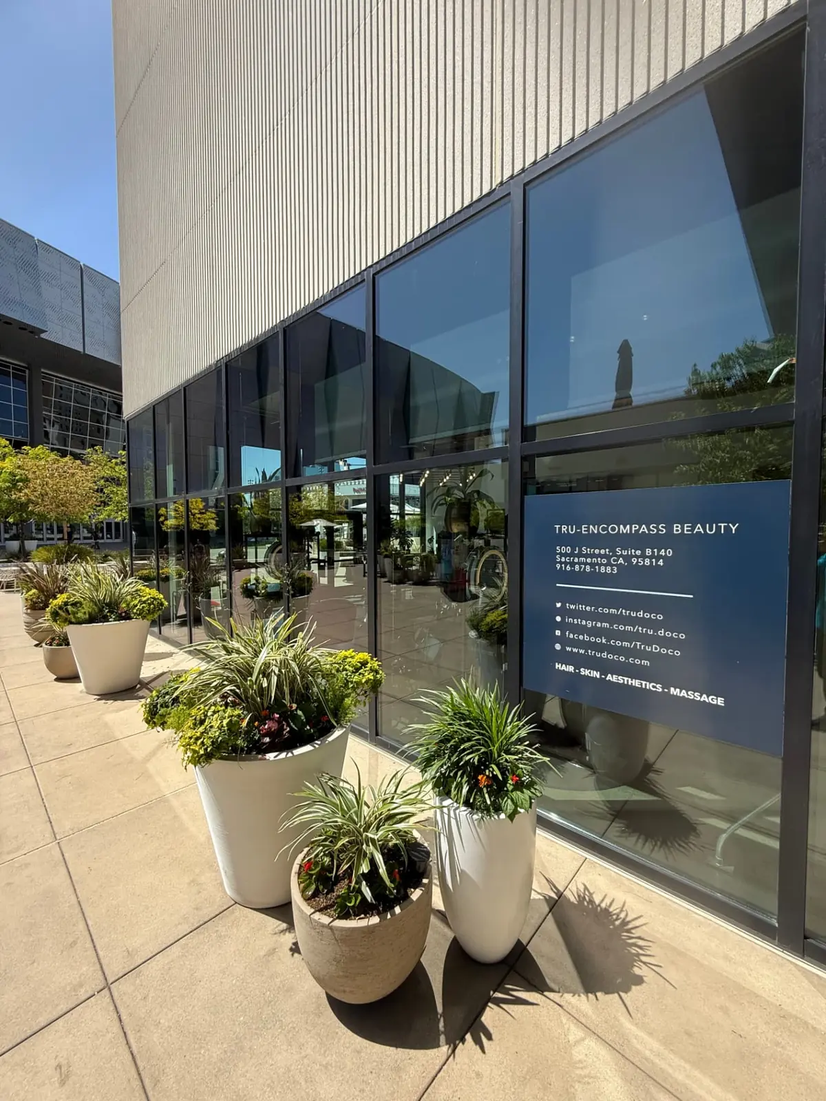 Clean floor-to-ceiling storefront glass at a beauty and wellness studio in downtown Sacramento