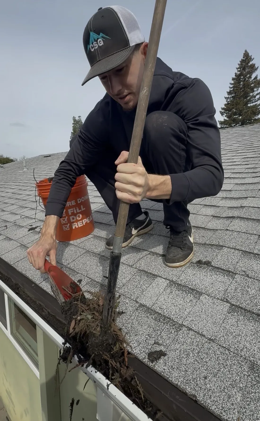Gutter Cleaning being performed by a CSG technician
