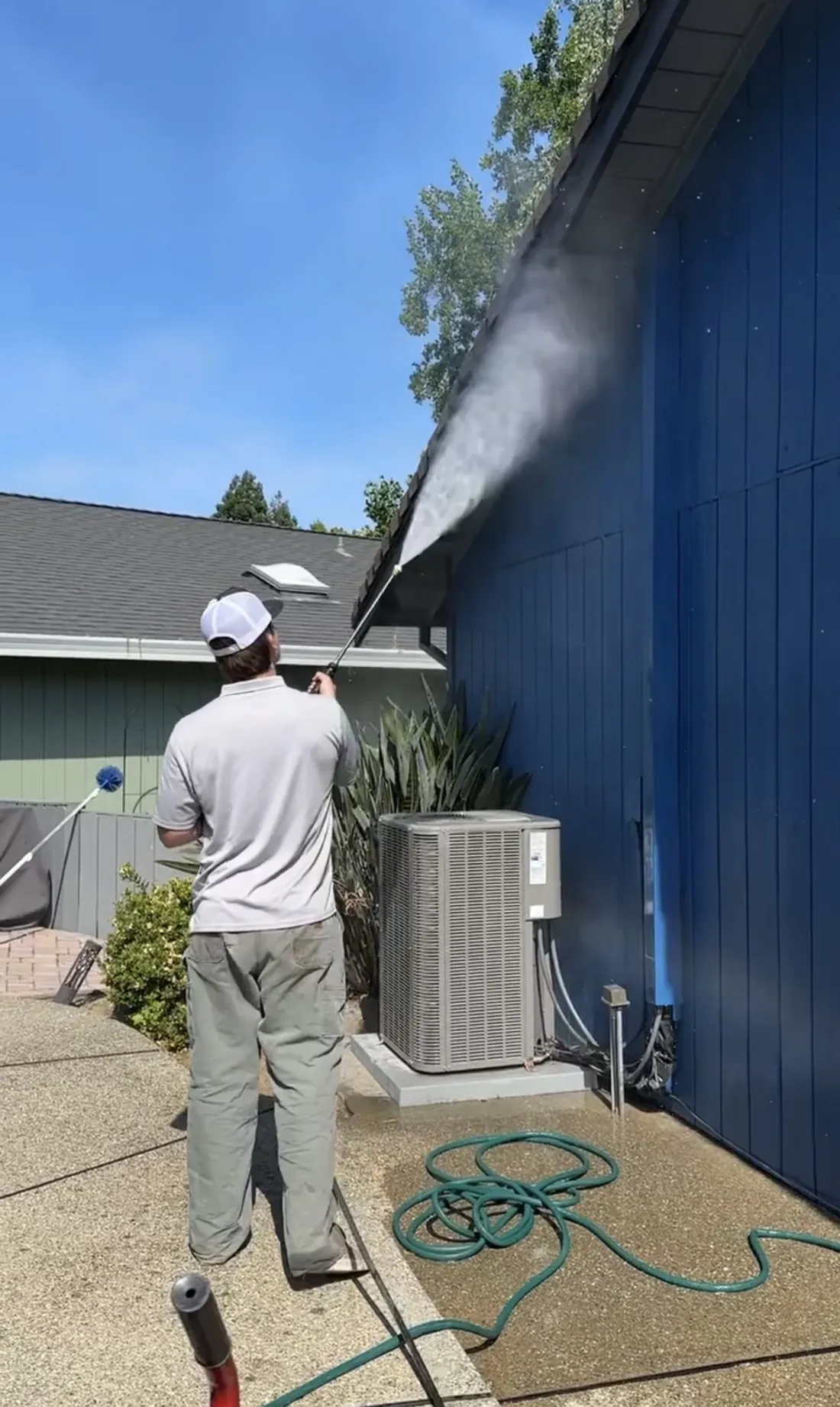 House Washing being performed by a CSG technician