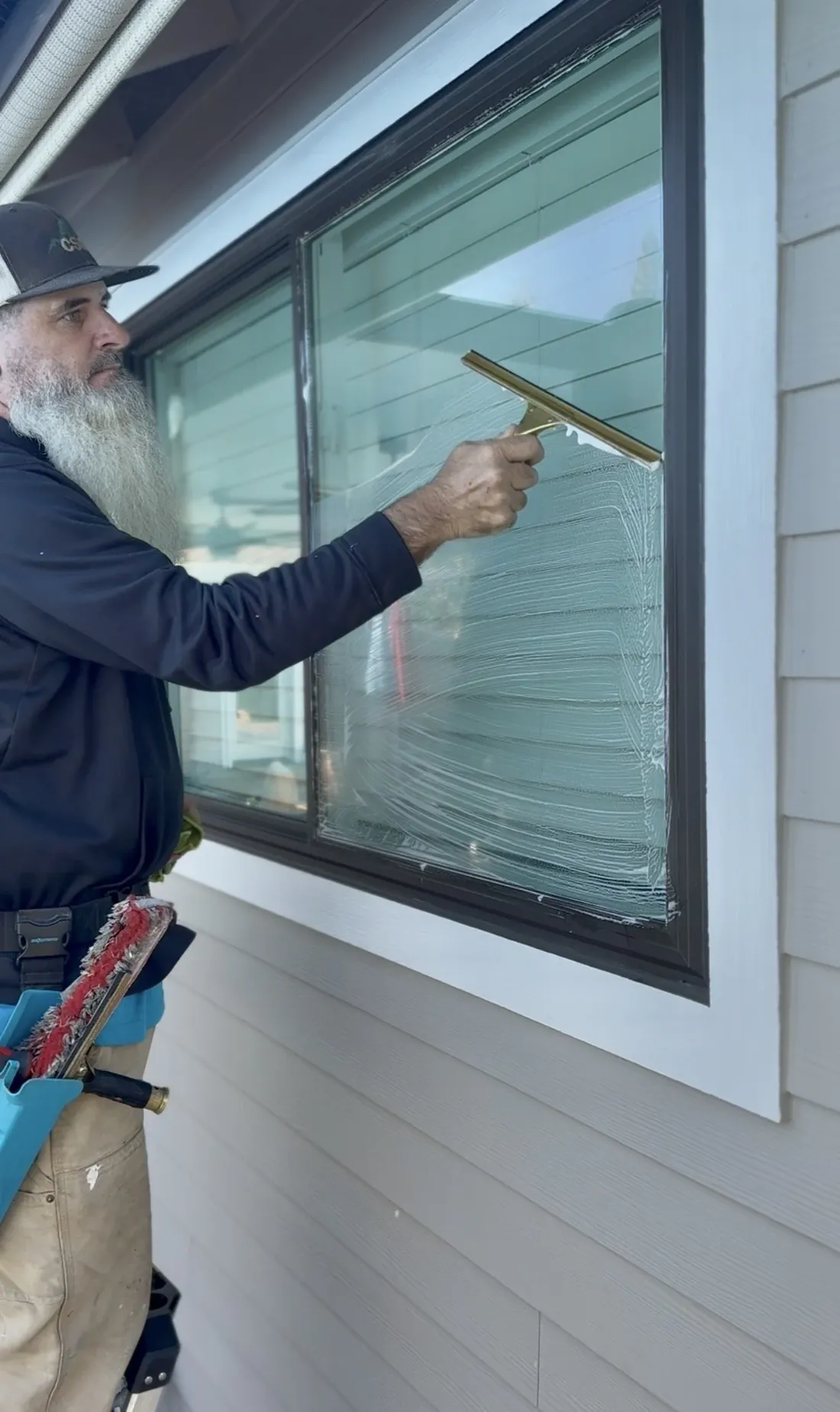 Window Cleaning being performed by a CSG technician